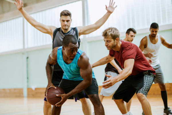 Friends playing basketball