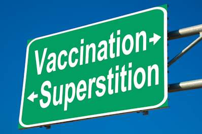 Vaccination facts and superstitions sign.