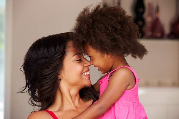 woman with young daughter image