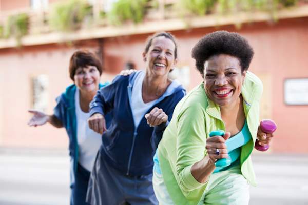 Happy women working out.