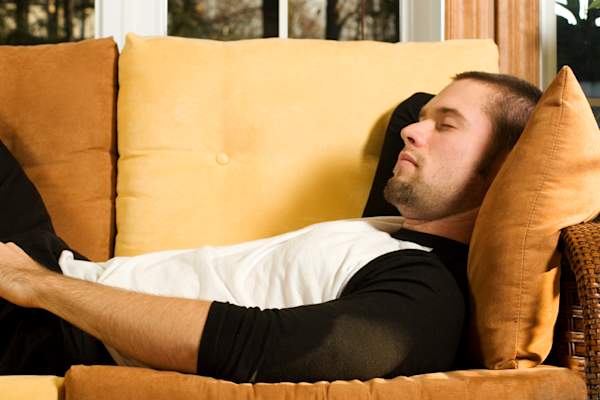 Man napping on the couch.