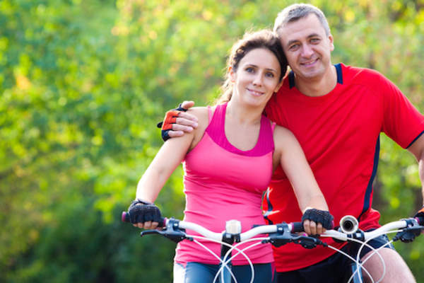 mature couple on bikes