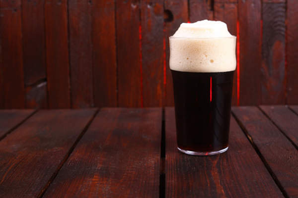 Heady, amber glass of beer