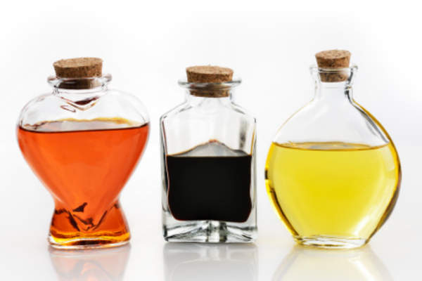 Vinegar and oil in corked glass