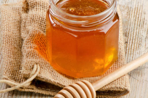 Glass jar of honey