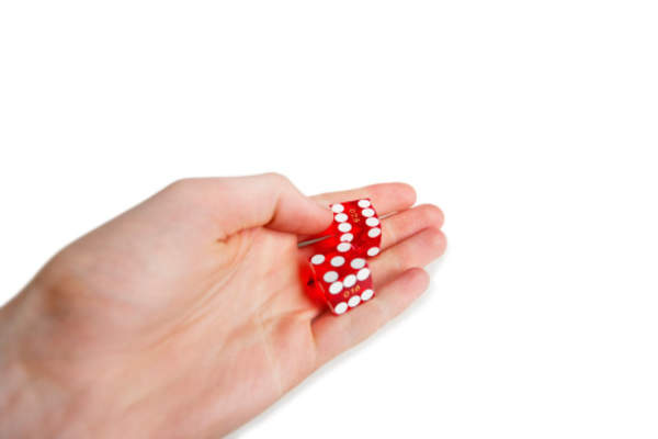 Dice in hand.