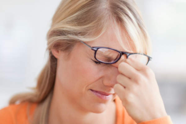 Woman with a headache.