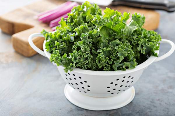 Kale in a strainer.