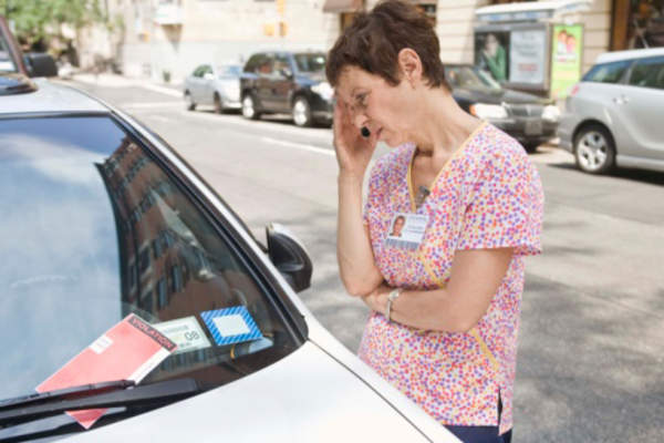 Woman upset about parking ticket.
