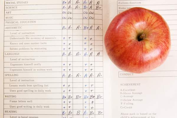 School report card and apple.