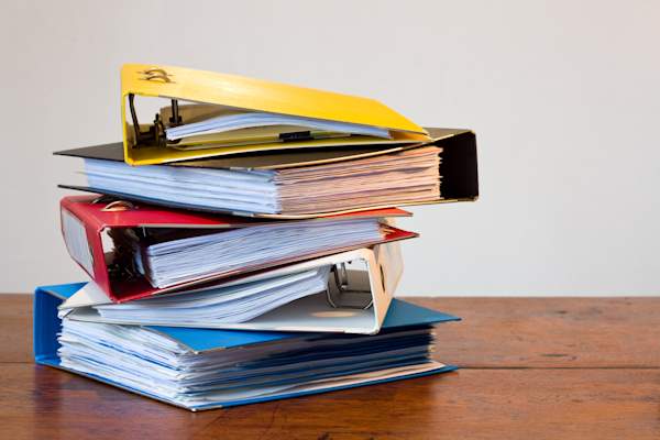 Stack of binders and books.