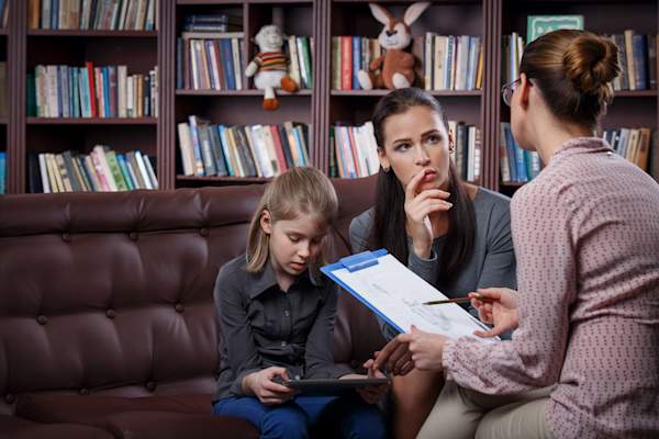 Mother and daughter meeting with IEP professional.