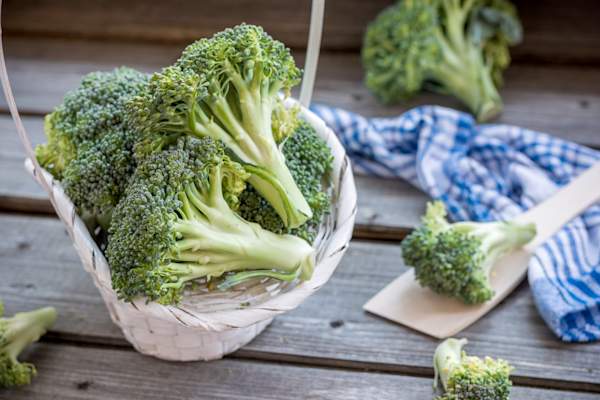 Broccoli on a rustic table.