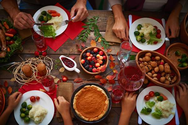 Choosing from a wide selection of Thanksgiving foods.