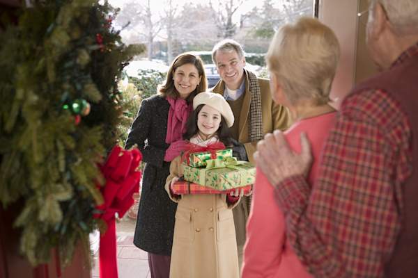 Family arriving arriving at grandparents' house for Christmas.