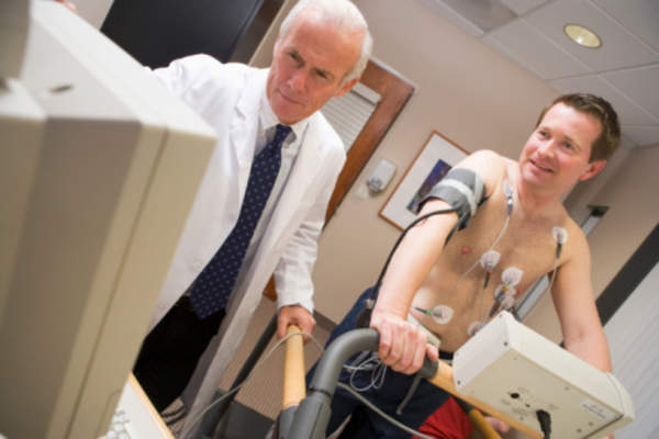 Man taking an exercise test with a doctor.