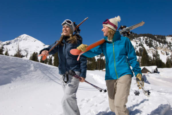 Skiiers walking together.