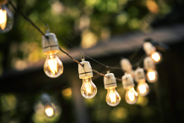 Patio lights outside at night.