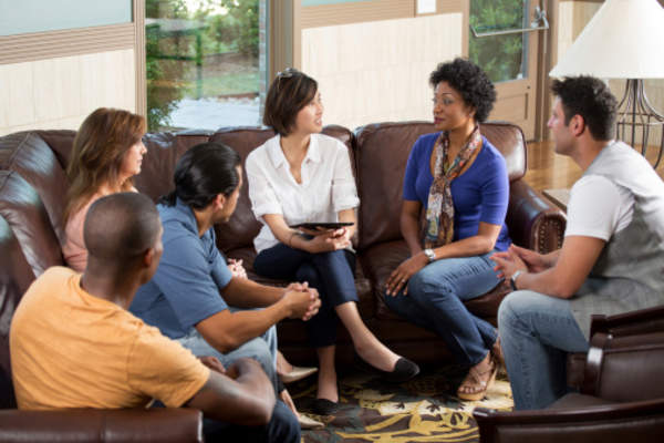 People talking in a support group.