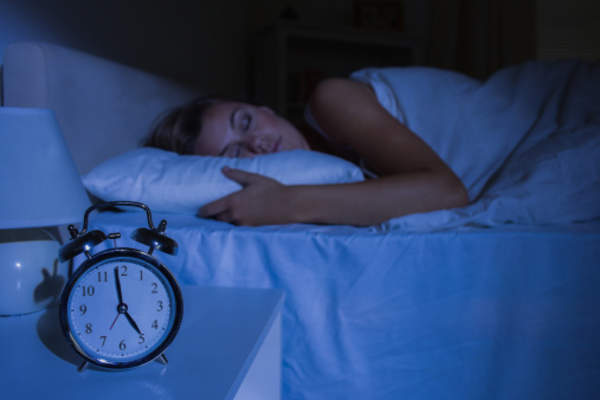 Woman sleeping in the early morning hours.