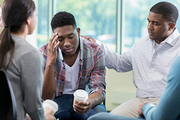 Stressed man at a support group.