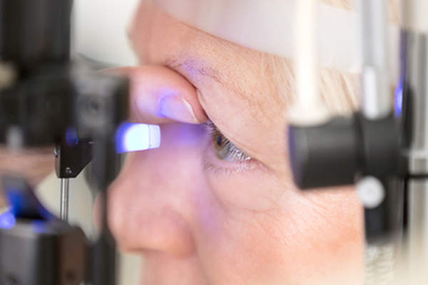 Woman having a glaucoma eye test.
