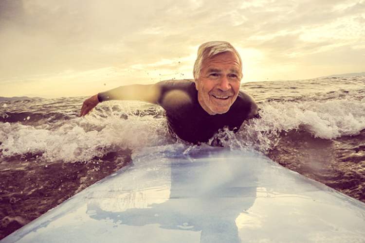 Older man surfing