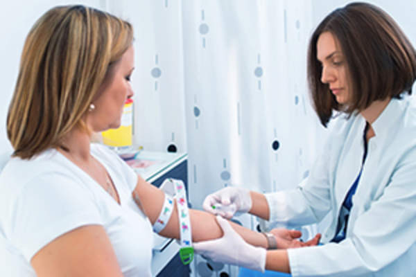 nurse performing blood test
