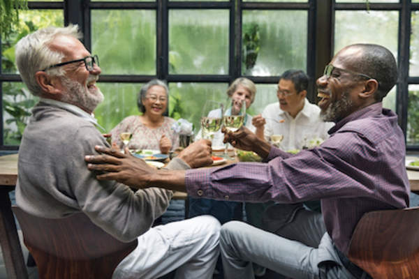Talking with friends over dinner and drinks.