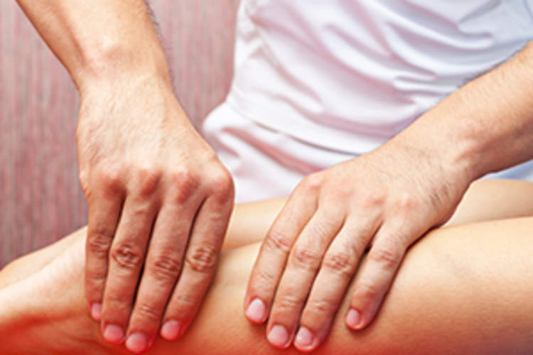 Woman Receiving Calf Massage