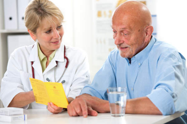 Reviewing vaccinations with doctor before travel.