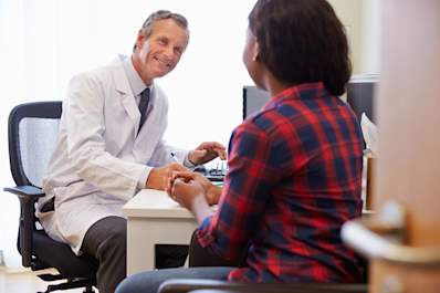 Doctor talking to patient about clinical trials.