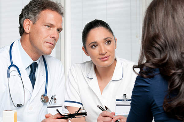 woman talking to health care team image