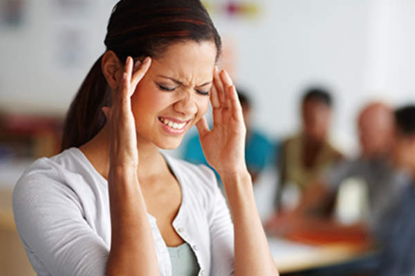 Woman with a painful migraine.