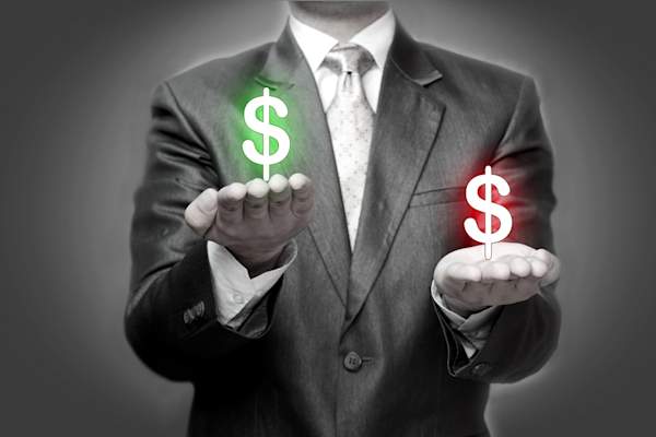 Businessman holding dollar symbols