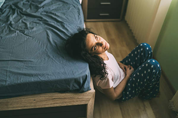 Depressed woman unable to sleep.