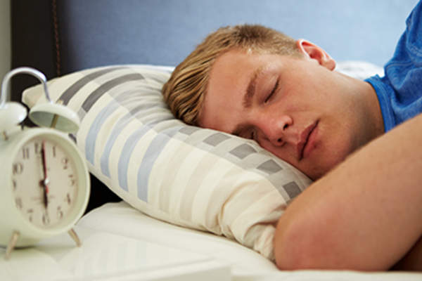 Teenage boy sleeping.