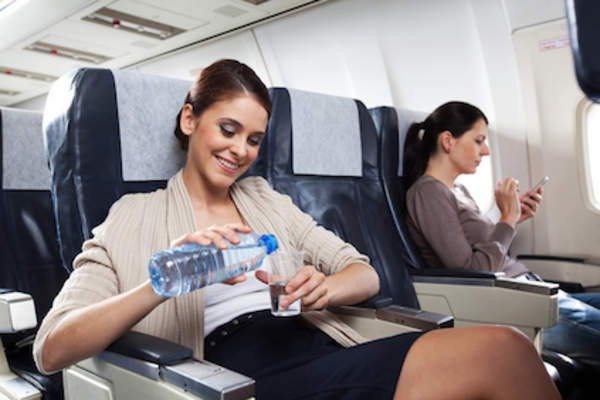 Drinking water on plane.