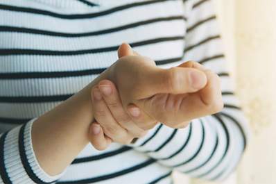 Woman holding her wrist in pain.