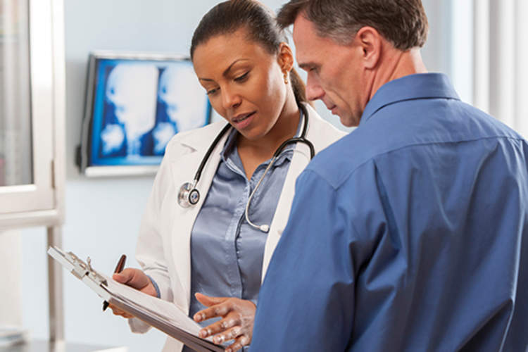 Doctor explaining diagnosis to a patient.
