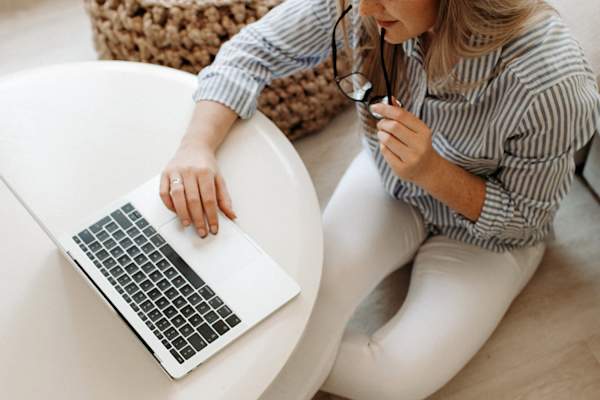 woman doing research on laptop
