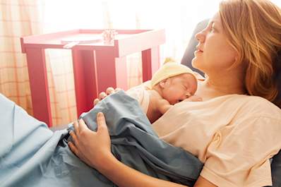 Mother and newborn infant at the hospital.