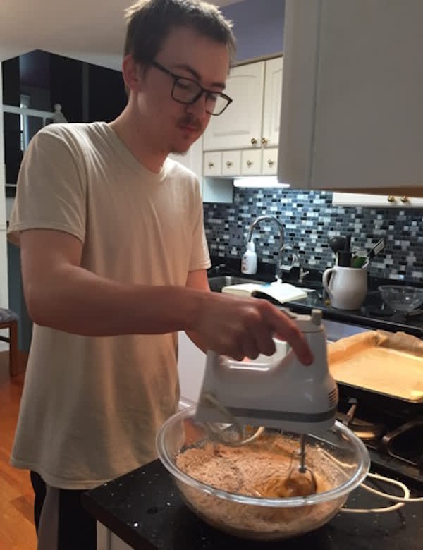 How to Make Gluten-Free Pumpkin Roll-Cathy's son mixing batter