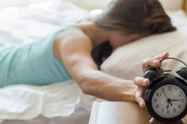 Not ready to rise, smacking alarm clock.