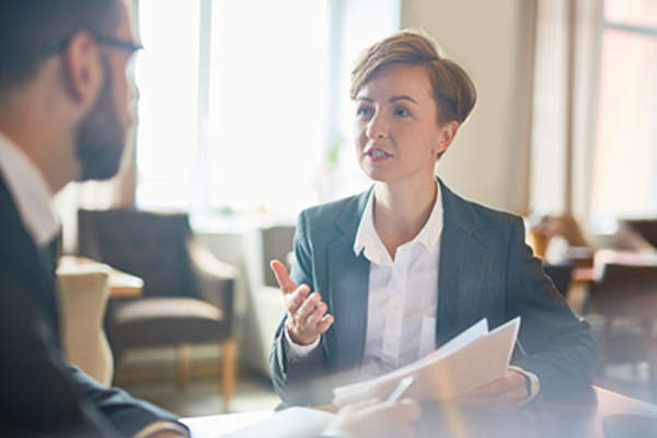 Professionals talking in a meeting.
