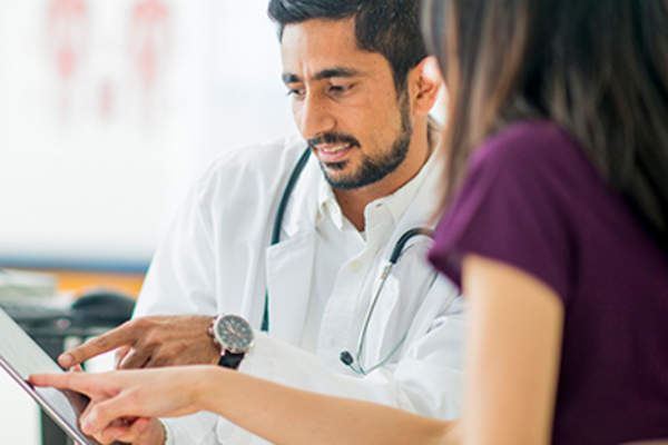 Female patient talking to her doctor.