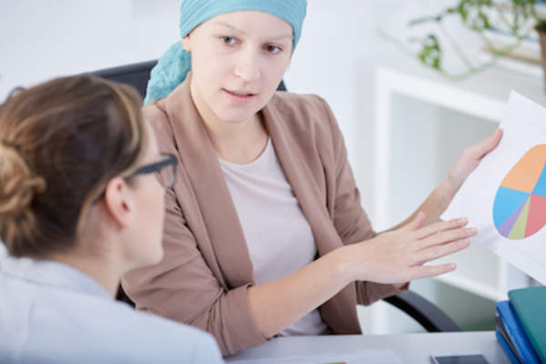 Chemo patient still working at office.