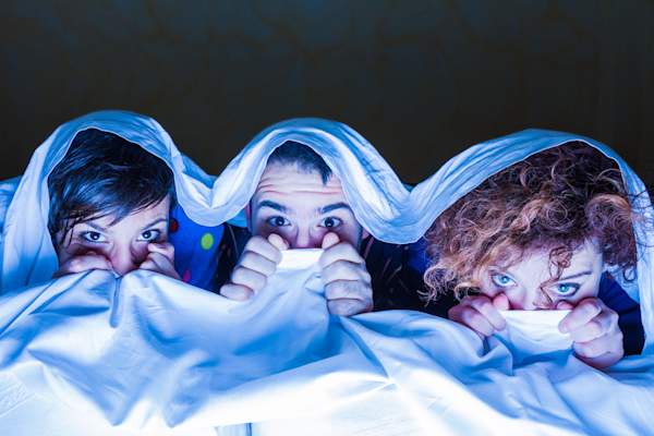 Sharing bed watching scary movie at slepp over