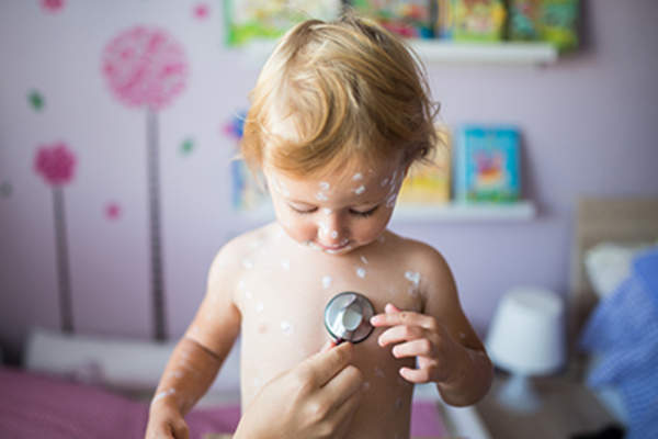 Toddler with rash at doctor's office.