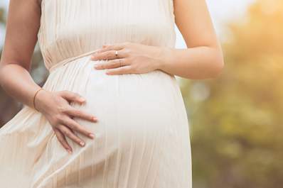 Pregnant woman outside.